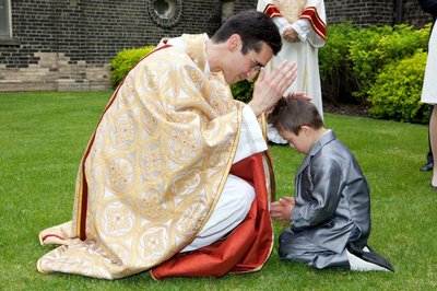 New Toronto priest blesses child May 2012.jpg